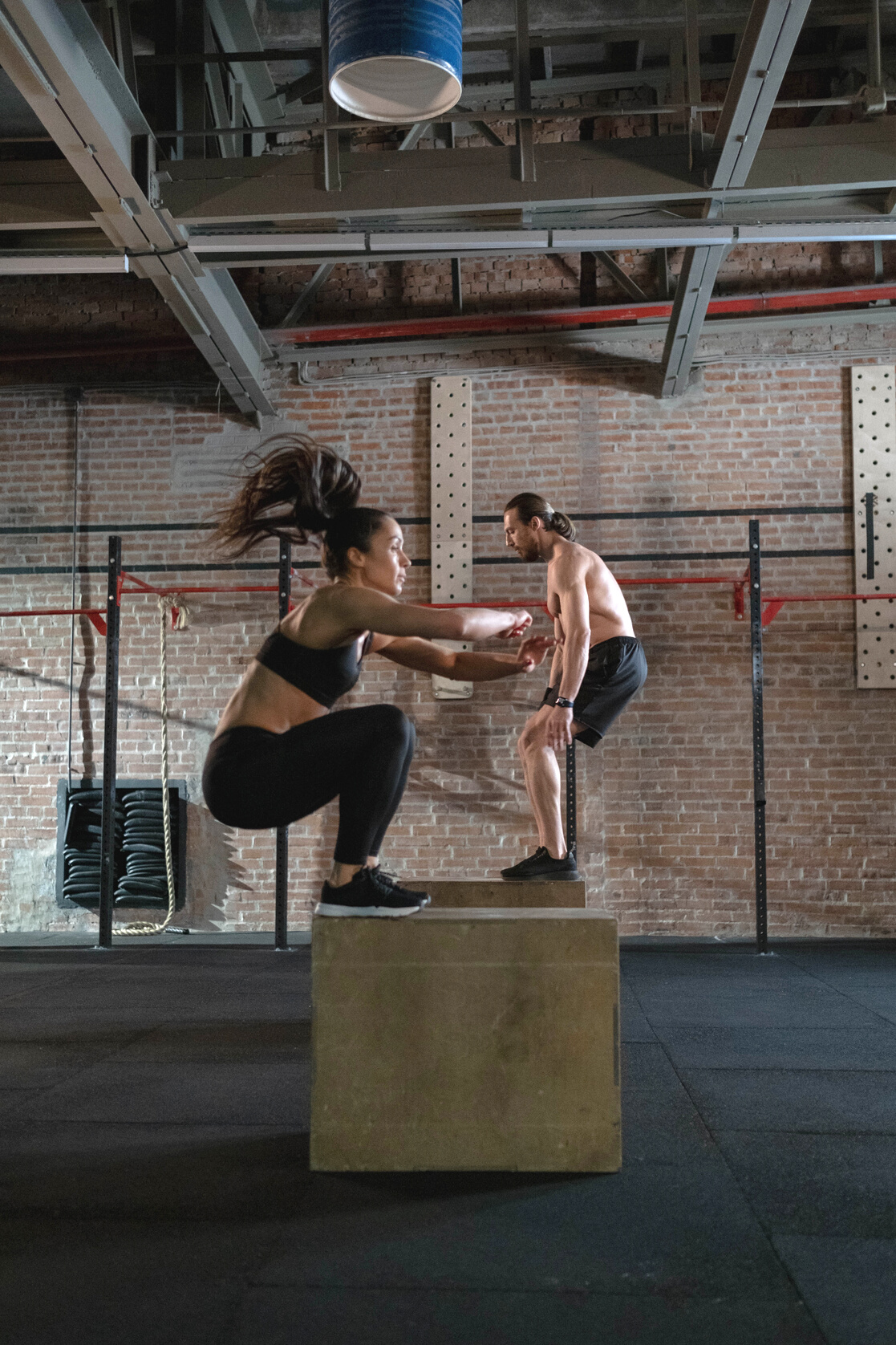 Man and Woman Practicing Plyometrics